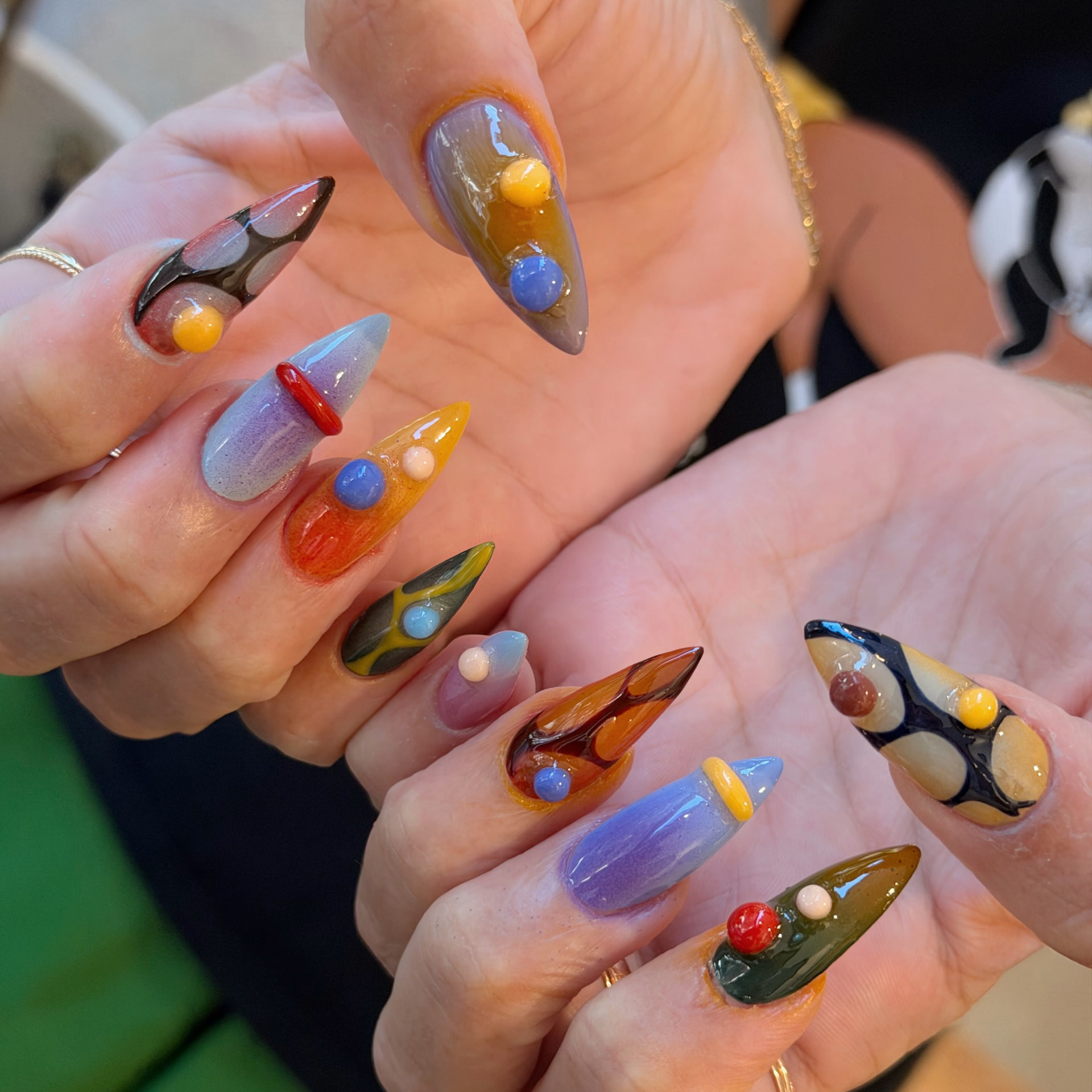 Colorful jelly stiletto nails with 3D beads